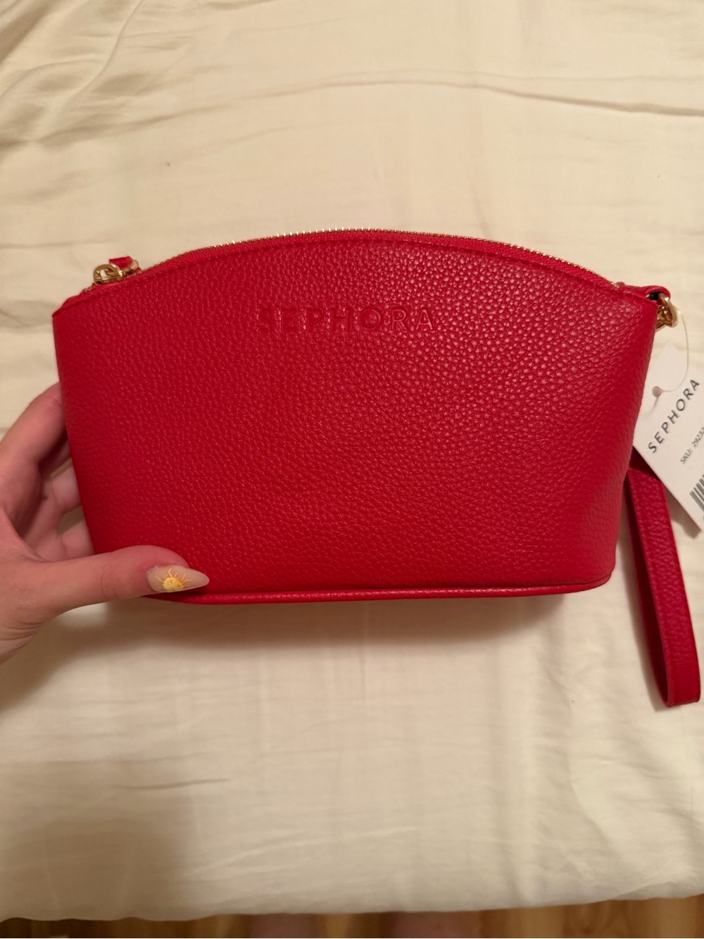 Sephora red pebbled wristlet makeup pouch with strap